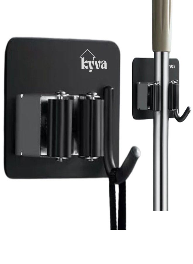 KYVA حامل مكانس من الفولاذ المقاوم للصدأ مثبت على الحائط من قطعتين من KYVA - حامل مكانس وممسحة شديد التحمل ذاتي اللصق للمنزل والمطبخ والحديقة وغرفة الغسيل والجراج (أسود). - Image 1